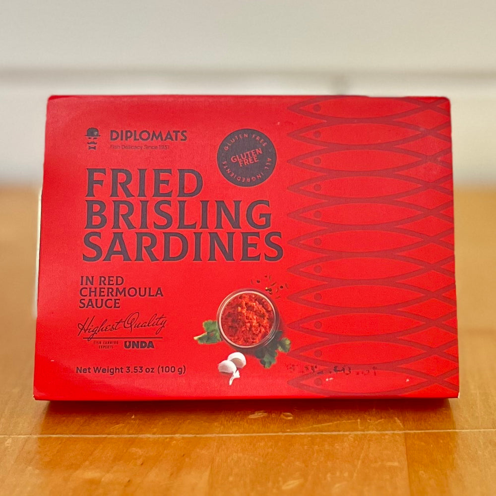 DIPLOMATS Fried Brisling Sardines In Red Chermoula Sauce